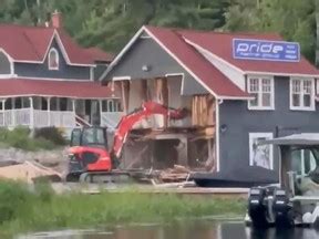 guy destroys building with mini excavator|Man charged after 'shocking' video shows excavator tearing into .